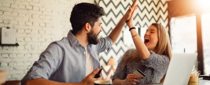 couple celebrating poor credit improved